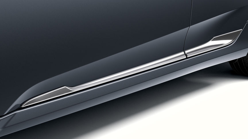 Nærbillede af pyntelister nederst på dørene i krom på Honda Civic 4-dørs.