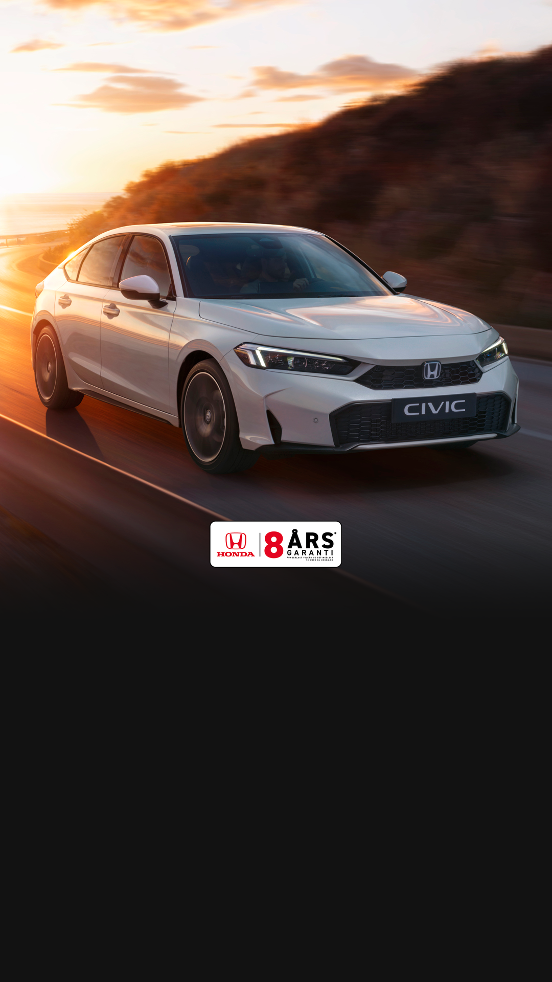 Honda Civic Hybrid driving on a highway